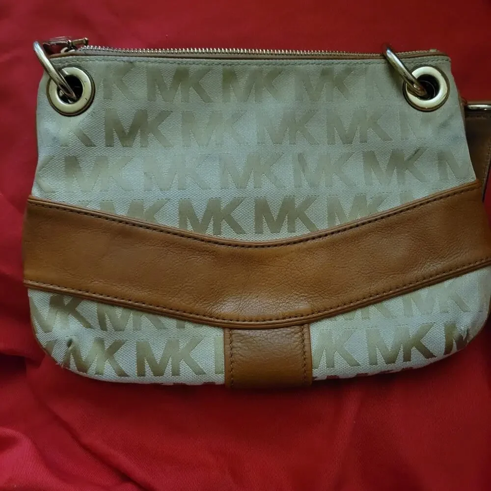 Michael Kors Jamesport Signature Handbag Tab with Leather and Gold Trim Striking